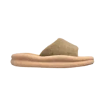 Person wearing Skylrko Rest Slide Sand on urban street pavement with casual streetwear outfit