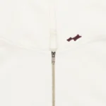 SKYLRK Knit Zip Hoodie in Natural No Dye — front view with zip fully closed showing relaxed oversized silhouette