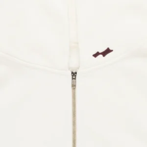 SKYLRK Knit Zip Hoodie in Natural No Dye — front view with zip fully closed showing relaxed oversized silhouette