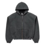 Side profile of SKYLRK oversized smudge zip hoodie showing drop-shoulder silhouette