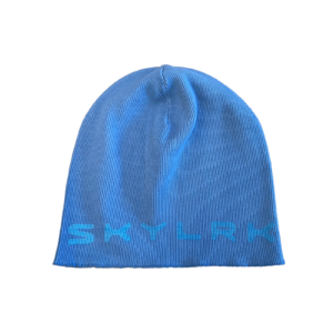 SKYLRK blue knit winter beanie worn outdoors in cold weather
